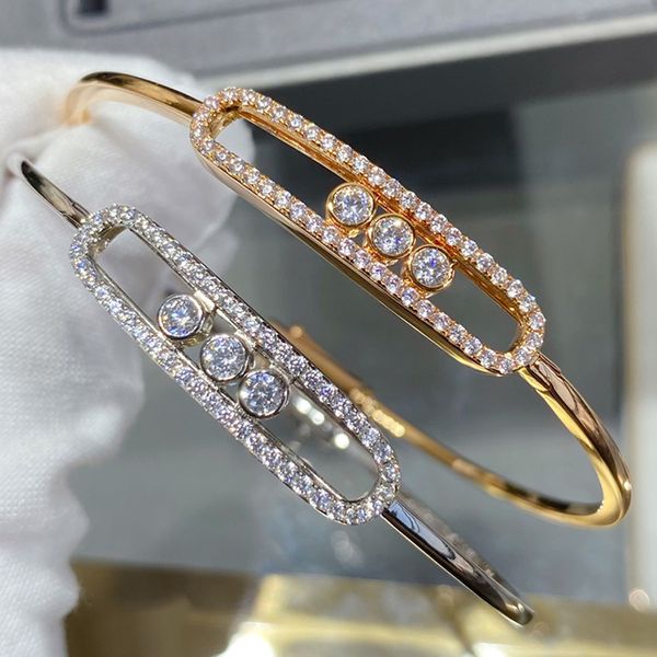 Elegant women's designer bangle bracelet with 18K gold plating, featuring diamonds and a timeless classic style, perfect as a gift for her