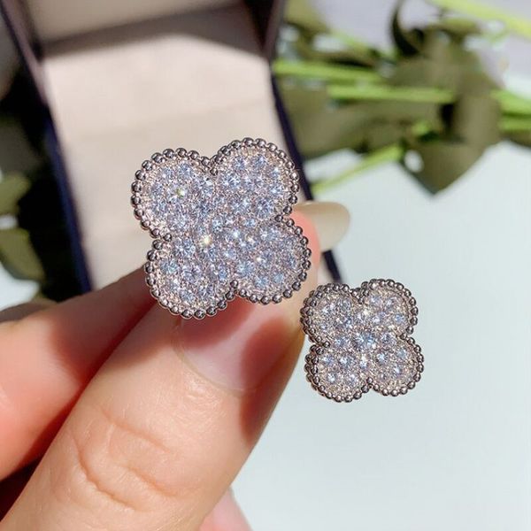 Elegant women's designer rings featuring dazzling full diamond double flower designs for weddings and fashion