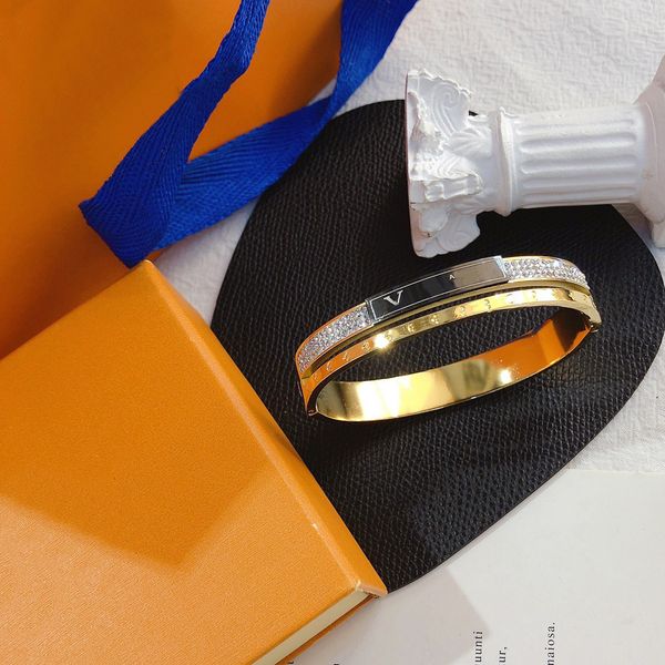 Elegant women's fashion bangle with designer lettering, featuring crystal accents and 18K gold-plated stainless steel, perfect for weddings and lovers
