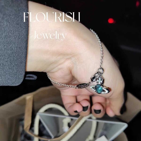 Empress Xi's stylish Saturn bracelet features rotating glass beads, blending fashion with luxury craftsmanship