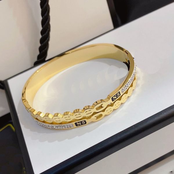 European American fashion bangle bracelet for women with designer letters, crystal accents, 18K gold plating on stainless steel, ideal as a wedding or lovers' gift jewelry
