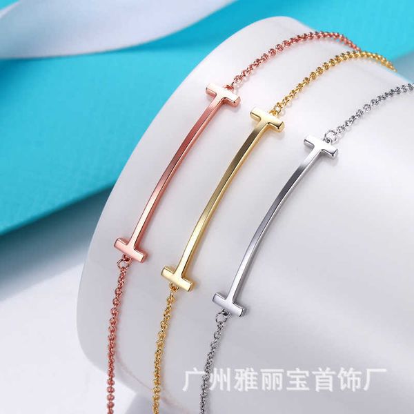 Factory-designed knot bangle bracelet with diamond accents and smooth finish, a stylish fashion accessory