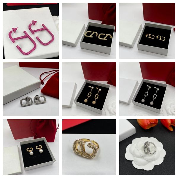 Fashion jewelry set featuring stylish ear studs, rings, bracelets, and necklaces with elegant packaging