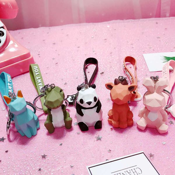 Fashionable and adorable dinosaur car keyring featuring a cute cartoon female PVC animal keychain with a hanging rope for handbag accessories