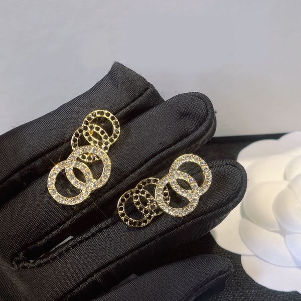Fashionable and elegant designer earrings with luxurious black and white diamond rhinestones, perfect for girls seeking high-end jewelry