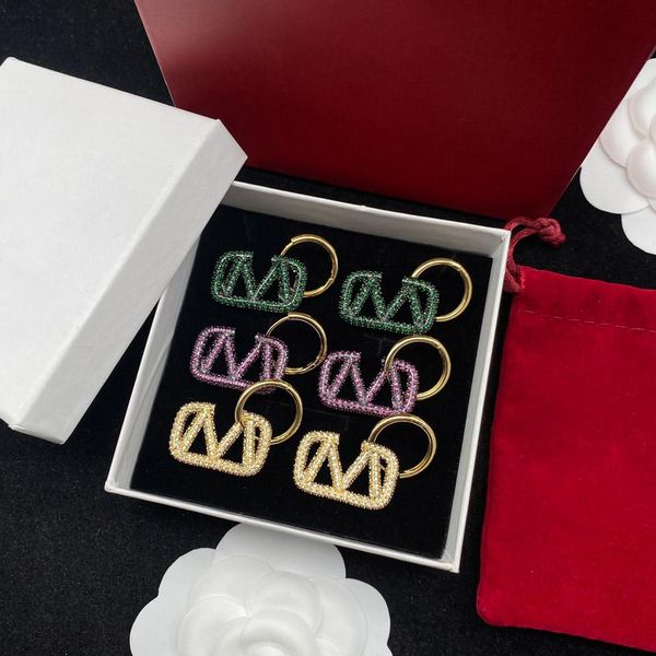Fashionable designer charm earrings for men and women in three classic colors