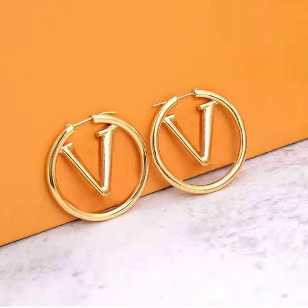 Fashionable gold stud earrings for women, perfect for parties, weddings, and as elegant gifts or engagement jewelry, featuring luxurious silver hoops