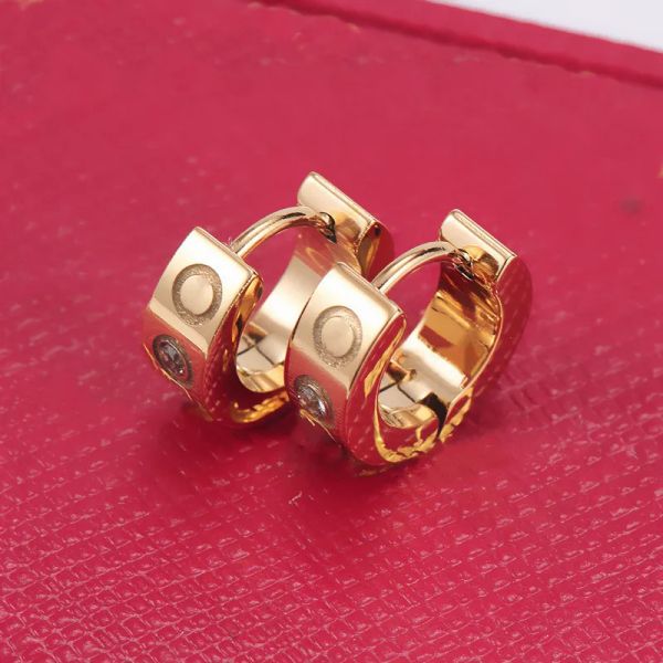Fashionable stainless steel hoop earrings for women in silver and gold, featuring love nail designs, perfect as wedding, engagement, or gift jewelry that won't fade