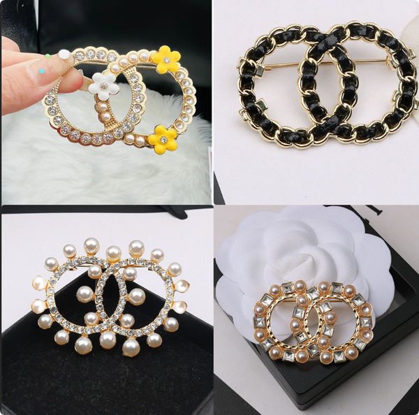 Fashionable unisex designer brooches featuring rhinestones, diamonds, crystals, and pearls for stylish suit accessories in 20 elegant designs