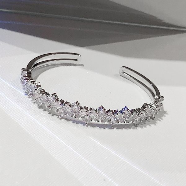 Fashionable white gold-filled bangle with zircon accents, perfect for bridal and wedding jewelry