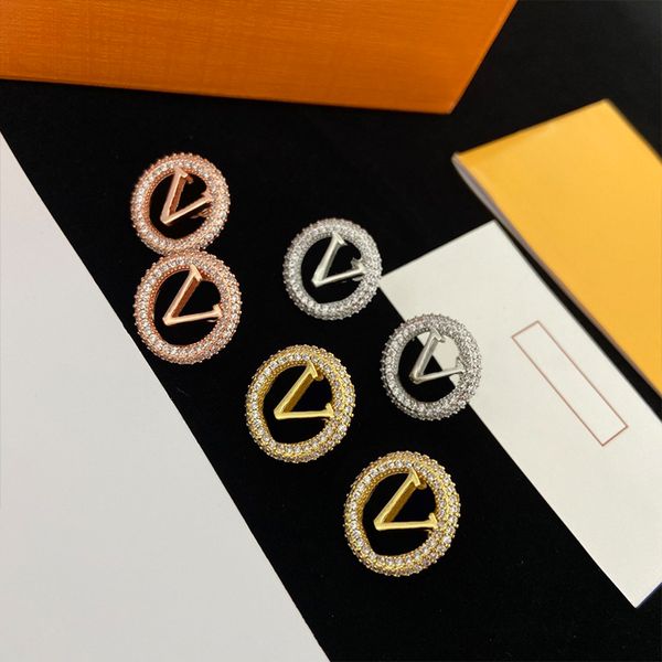 Fashionable women's diamond earrings in classic charm design, available in three colors