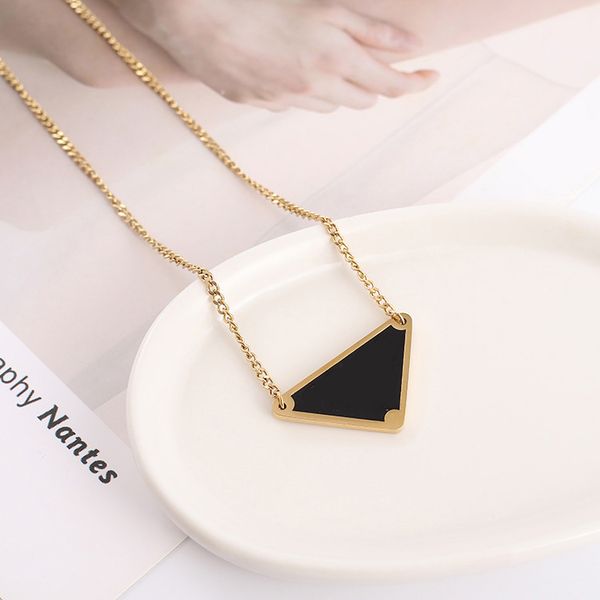 Gold, black, white, and pink triangle pendant necklaces for men and women, featuring luxury designer titanium steel chains