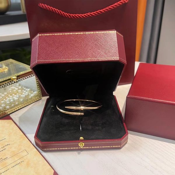 Gold designer bracelets and bangles for women and men, crafted from stainless steel alloy with gold, silver, or rose plating, featuring diamond accents
