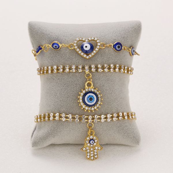 Gold-plated double-line tennis chain bracelet with evil eye charm for stylish women