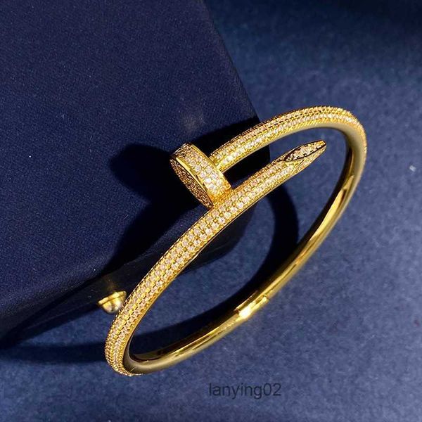 Gold-plated heart-shaped bangle with CZ crystals, a forever love jewelry piece for women