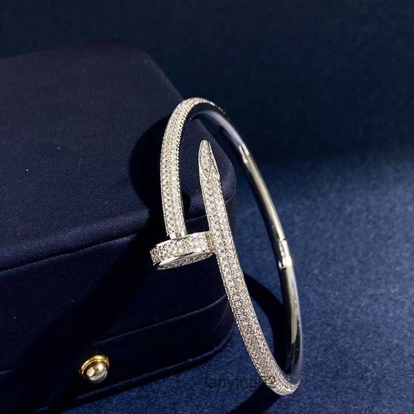 Gold-plated heart-shaped bangle with CZ crystals for women, symbolizing eternal love