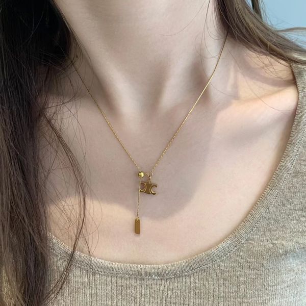 Gold-plated titanium steel necklace featuring an Arc de Triomphe pendant on a collarbone chain for women