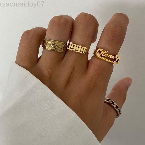 Goth-inspired birth year rings for women in stainless steel with gold finish, trendy 2022 unisex jewelry perfect as birthday gifts or stylish accessories