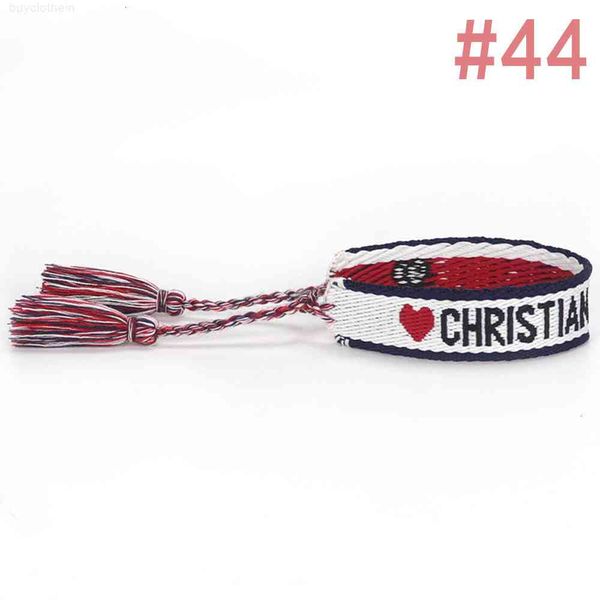 Handcrafted bracelet with embroidered letters and tassel details