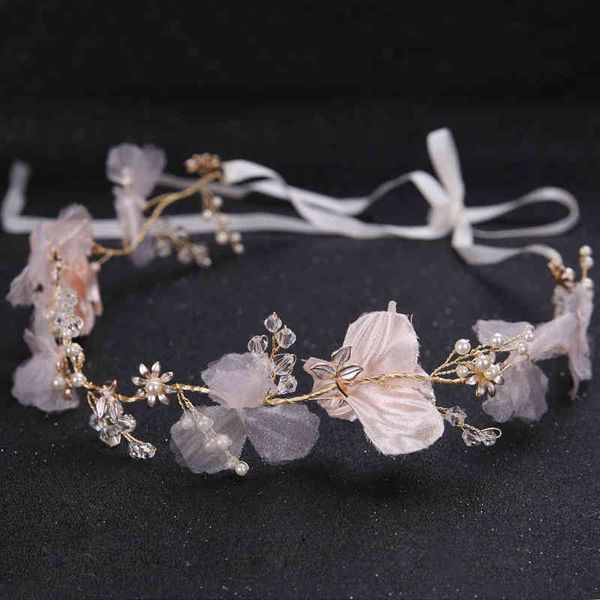 Handcrafted bridal hair accessories featuring fabric flowers for wedding and studio photography