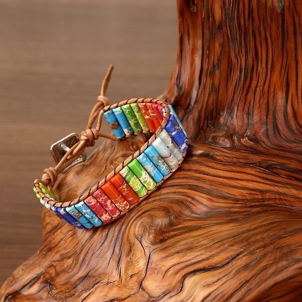 Handcrafted charm bracelets featuring multicolor natural stone beads, leather bangles, and decorative charms for stylish wrist jewelry gifts