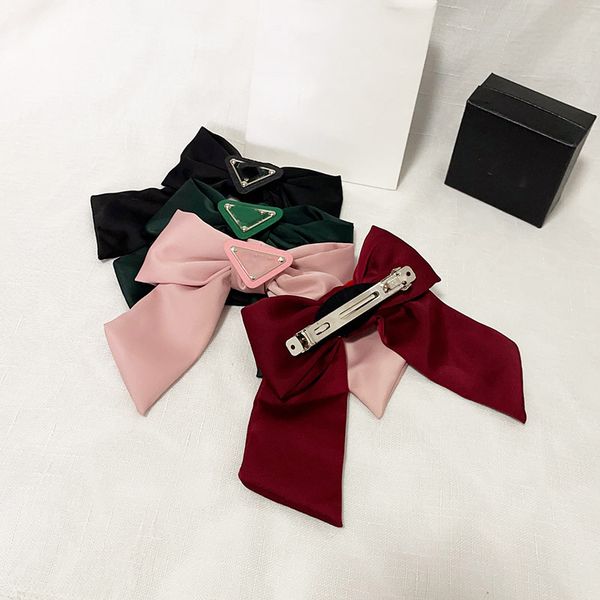 Headbands, hair clips, and barrettes for women and girls, featuring inverted letter triangle designs, bowknot styles, and classic hair jewelry headdress accessories