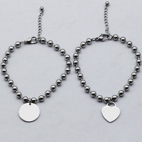 Heart-shaped bracelets with hollow beads and stainless steel round beaded chains, stylish hand jewelry for wholesale gifts and girlfriend accessories