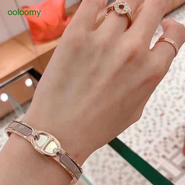 Hemres Designer Gold-Plated Brass Women's Bracelet with Synchronized Pig Nose Enamel Design