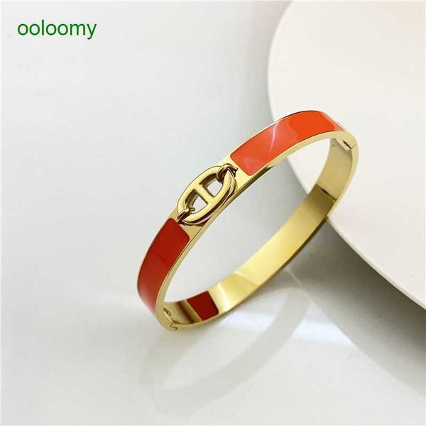 Hemrres Designer Bracelet featuring a family-themed enamel pig nose love charm, anchor chain, 8-way buckle, and couple style in gold
