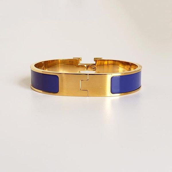 High-end designer bangle with stainless steel and gold buckle, a stylish summer accessory for both men and women