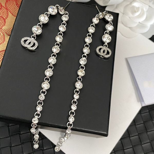 High-quality designer pearl stud earrings in real gold, brass, and copper with stamped round letters, perfect for elegant women at weddings and parties