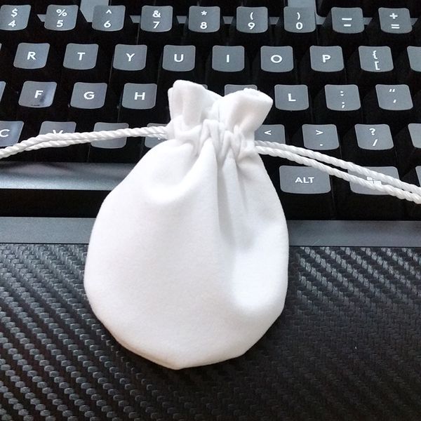 High-quality white velvet jewelry pouches for bracelets, necklaces, and charms, available wholesale for gift packaging