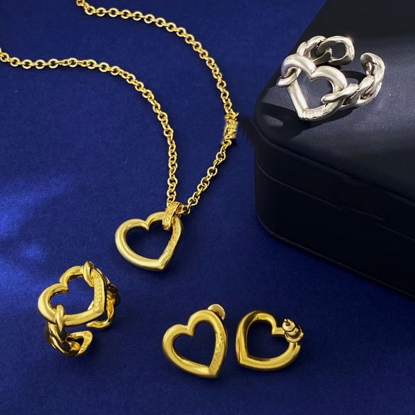 Hollow Heart Pendant Necklace featuring a 3D hard gold peach heart design with matching clavicular chain, ear studs, couple earrings, ring, and sweater chain jewelry accessories MN14