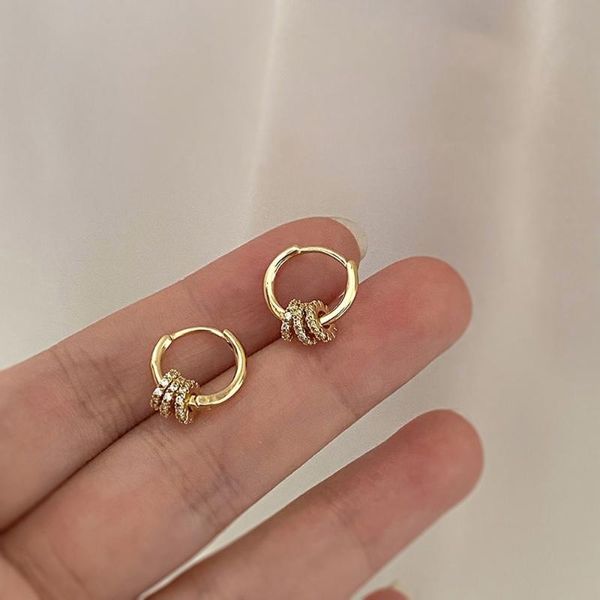 Hoop & Huggie 2022 Korean-inspired geometric earrings for women featuring shiny cubic zirconia and metal ring clasps, a simple yet fashionable jewelry piece
