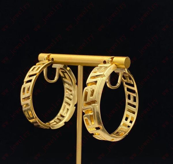 Hoop & Huggie Gold vintage hollow plain back interlocking pattern large circle earrings, jewelry designers create simple unique pieces