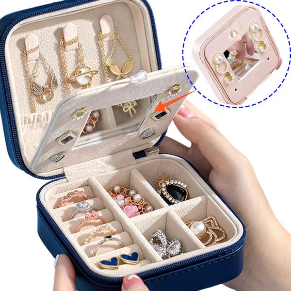 Jewelry storage case with mirror for travel, organizing earrings, necklaces, and rings in a simple leather display box