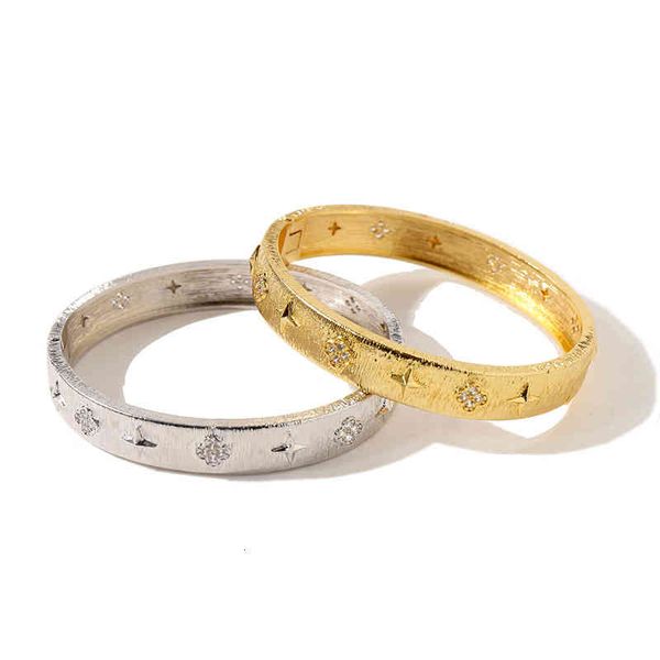 Korean-style charm bracelet featuring brushed star and four-leaf flower designs
