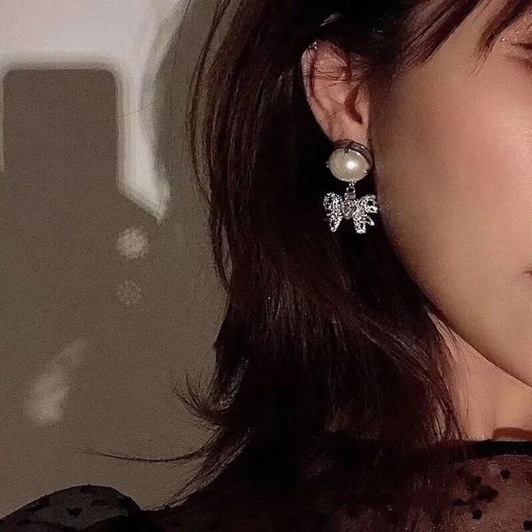 Korean-style Cuff Stud Earrings by Miss Miao, featuring elegant bow designs with full diamond and pearl accents in 925 silver for autumn and winter wear