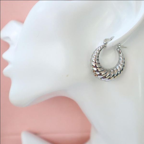 Large hollow yellow gold hoop earrings, 58mm (2.2") or 50mm (1.9"), in shrimp oval shape with huggie style