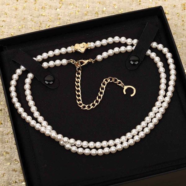 Luxurious 18k gold-plated long pendant necklace featuring natural shell beads, stamped with heart PS3396B, includes box
