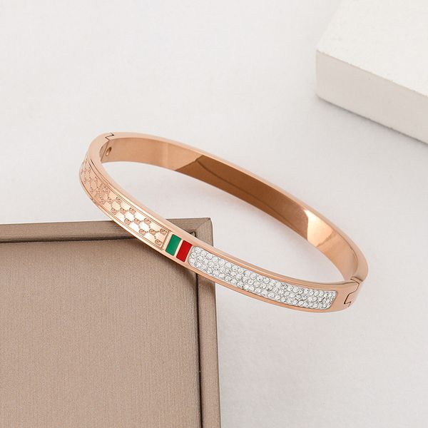 Luxurious 18K gold-plated stainless steel bangle bracelet with white zircon stones, a stylish women's jewelry gift