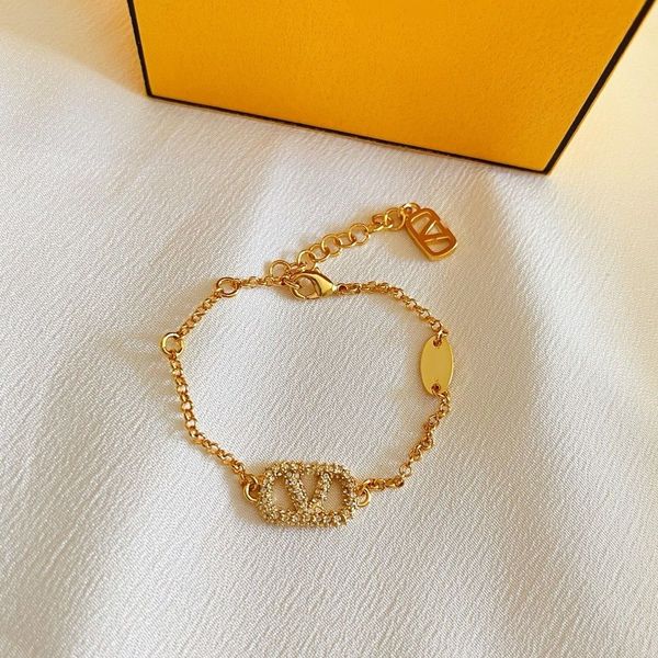 Luxurious 2023 women's bracelet featuring a gold heart-shaped pearl and crystal design with double V letter charms in 925 silver