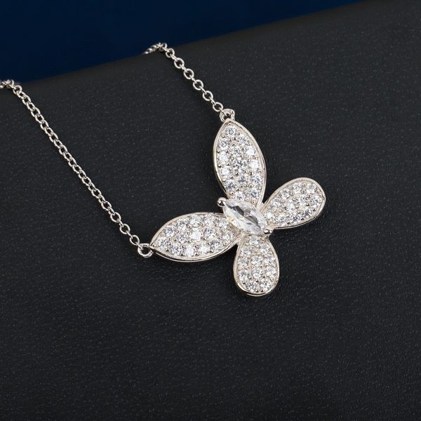 Luxurious 3D hollow bowknot-shaped 925 sterling silver jewelry set for women, featuring elegant earrings, pendants, and necklaces