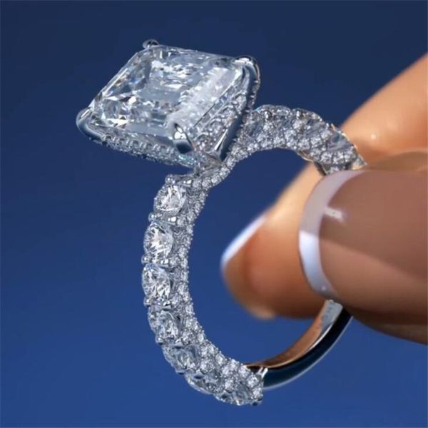 Luxurious 925 sterling silver wedding ring featuring emerald-cut white topaz and Diamonique CZ gemstones for women's engagement and special occasions