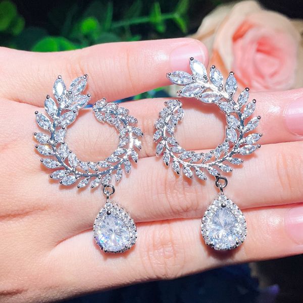 Luxurious bridal silver earrings featuring South American pearls and AAA cubic zirconia in white, blue, and red hues