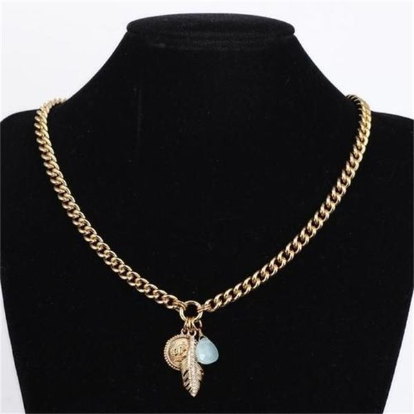 Luxurious chic feather-inspired golden round necklace with diamond accents and multi-drop design