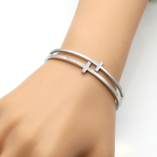 Luxurious CZ-embellished cross bangle bracelet, a perfect women's gift