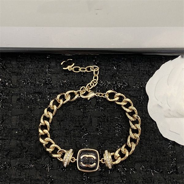 Luxurious designer charm bracelets for women, featuring classic gold jewelry with elegant letter detailing and stylish cuff designs for men