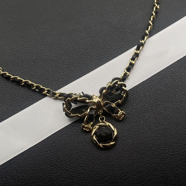 Luxurious designer choker necklace featuring a gilded leather butterfly pendant