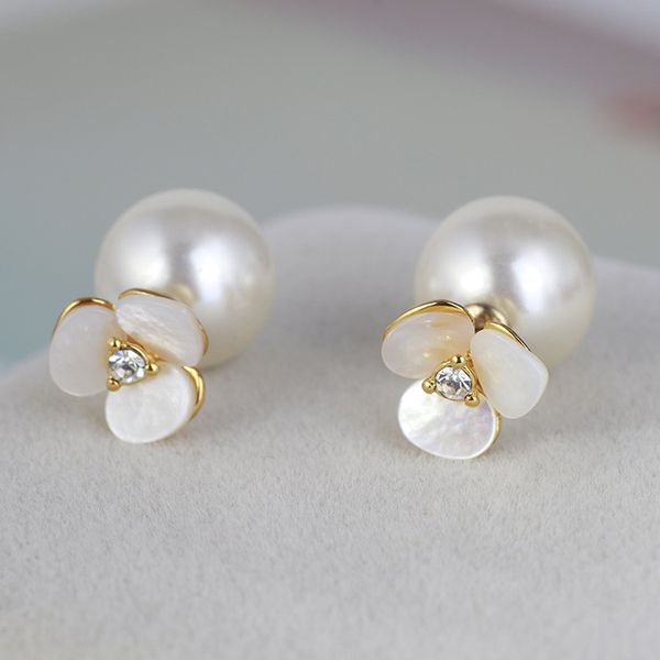 Luxurious designer stud earrings featuring big pearls, double-sided crystal roses, and stainless steel charm details